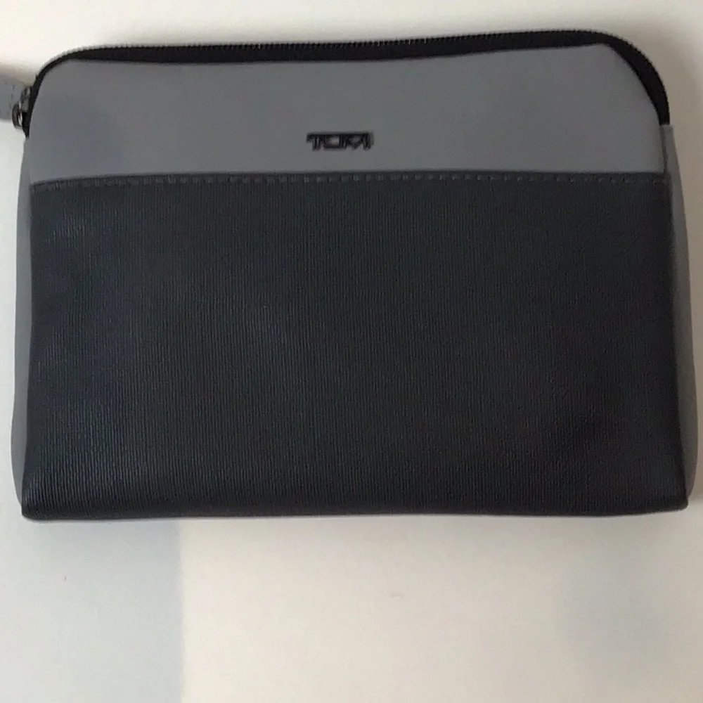 Almost complete Tumi amenities bag.